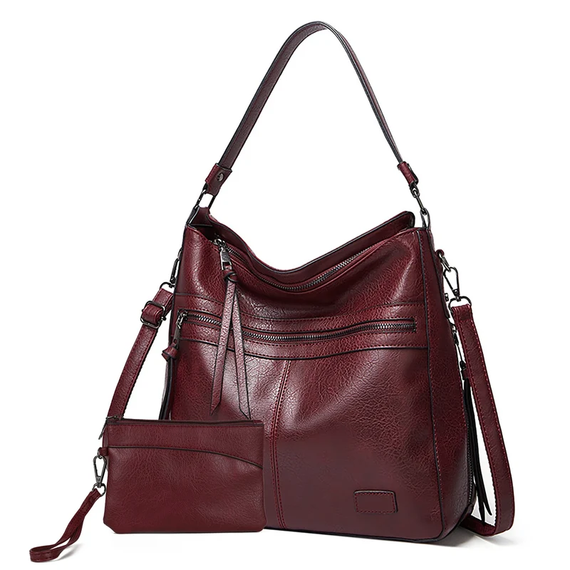 Designer schoudertassen voor dames - Grote leren schoudertassen voor op reis en weekendjes weg.