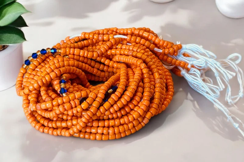 Waist Beads / Afrikaanse Heupketting - Okpara - Oranje / blauw (Traditioneel niet-elastisch koord)