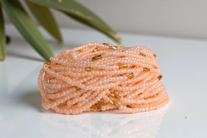 Waist Beads / Afrikaanse Heupketting - Ogbe - Perzik / goud (Traditioneel niet-elastisch koord)