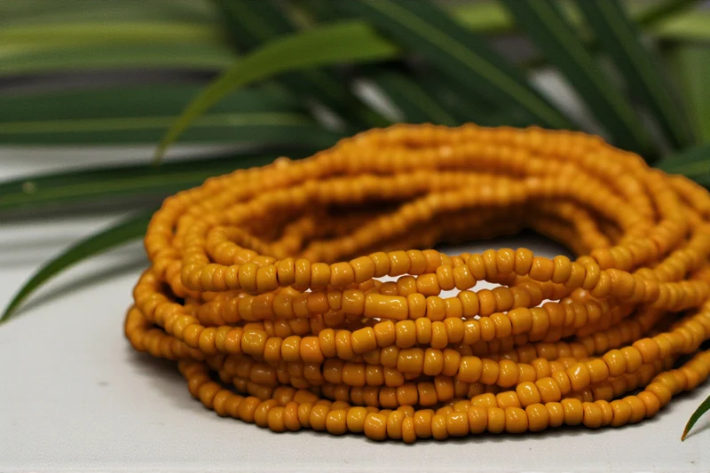 Waist Beads / Afrikaanse Heupketting - AIGBE - Okergeel (elastisch)